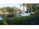 Waterfront backyard with seating on the canal, providing a serene outdoor living space at 5805 Oxford Dr, Tampa, FL 33615