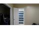 Bathroom with blue striped shower curtain conveniently located next to bedroom closet at 5805 Oxford Dr, Tampa, FL 33615