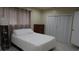 Serene bedroom with neutral decor, a comfortable bed, and ample closet space at 5805 Oxford Dr, Tampa, FL 33615