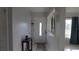 Bright foyer with a white front door, tiled floor, and a view into the adjacent living spaces at 5805 Oxford Dr, Tampa, FL 33615