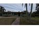 Charming single-story home with a well-maintained lawn and a brick walkway leading to the front door at 5805 Oxford Dr, Tampa, FL 33615