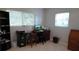 Functional home office setup with natural light, tile floors and ample storage at 5805 Oxford Dr, Tampa, FL 33615