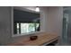 Bright kitchen pass-through with butcher block counters offers a stunning water view at 5805 Oxford Dr, Tampa, FL 33615