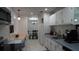 Modern kitchen featuring white cabinetry, efficient layout, and stainless steel appliances at 5805 Oxford Dr, Tampa, FL 33615