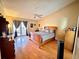 Main bedroom with wood bed frame and access to patio at 2321 Rothenfeld Ct, Land O Lakes, FL 34639