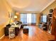 Living room with L-shaped sectional and hardwood floors at 2321 Rothenfeld Ct, Land O Lakes, FL 34639