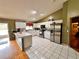 Spacious kitchen with stainless steel appliances and an island at 2321 Rothenfeld Ct, Land O Lakes, FL 34639