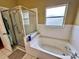 Bathroom featuring a shower and tub combination at 2321 Rothenfeld Ct, Land O Lakes, FL 34639