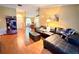 Living room with L-shaped couch and view into dining area at 2321 Rothenfeld Ct, Land O Lakes, FL 34639