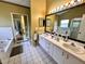 Bathroom with double sinks, garden tub, and separate shower at 2321 Rothenfeld Ct, Land O Lakes, FL 34639