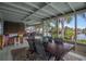Waterfront screened porch with dining area and bar at 4530 Flounder Dr, Hernando Beach, FL 34607