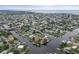 Aerial showing neighborhood, waterways, and waterfront homes at 4530 Flounder Dr, Hernando Beach, FL 34607