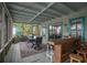 Screened porch with dining table and outdoor bar at 4530 Flounder Dr, Hernando Beach, FL 34607