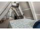 Upstairs bedroom with a queen bed and access to bathroom at 4530 Flounder Dr, Hernando Beach, FL 34607