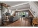 Open living area with spiral staircase, hardwood floors, and water views at 4530 Flounder Dr, Hernando Beach, FL 34607