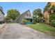 A-frame home with teal accents and a spacious yard at 4530 Flounder Dr, Hernando Beach, FL 34607