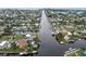 Aerial view of waterfront homes and properties with boat docks at 4530 Flounder Dr, Hernando Beach, FL 34607