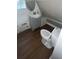 Small bathroom with gray vanity and wood-look floor at 4530 Flounder Dr, Hernando Beach, FL 34607