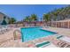 Relaxing community pool with lounge chairs and patio area at 6499 99Th N Way # 18B, St Petersburg, FL 33708
