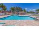 Inviting community pool with surrounding patio and seating at 6499 99Th N Way # 18B, St Petersburg, FL 33708