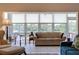 Sunroom with serene water views and ample natural light at 6499 99Th N Way # 18B, St Petersburg, FL 33708
