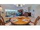 Elegant dining room with a charming wooden table and access to the living room at 6499 99Th N Way # 18B, St Petersburg, FL 33708