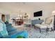 Open living room with comfortable seating and views into the dining area and kitchen at 6499 99Th N Way # 18B, St Petersburg, FL 33708