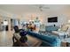 Open living room with comfortable seating and views into the dining area and kitchen at 6499 99Th N Way # 18B, St Petersburg, FL 33708