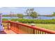 Deck overlooking a tranquil waterway with lush greenery at 6499 99Th N Way # 18B, St Petersburg, FL 33708