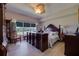Main bedroom with large bed, dresser, and tranquil water views at 6499 99Th N Way # 18B, St Petersburg, FL 33708
