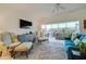 Relaxing living room with comfy seating, large windows, and a view of the water at 6499 99Th N Way # 18B, St Petersburg, FL 33708
