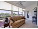 Bright sunroom with water views and comfortable seating at 6499 99Th N Way # 18B, St Petersburg, FL 33708