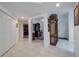Bright entryway with tile floors and built-in shelving at 6499 99Th N Way # 18B, St Petersburg, FL 33708