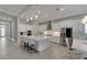 Modern kitchen with large island and stainless steel appliances at 5608 Madrigal Way, Apollo Beach, FL 33572