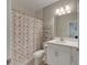 Small bathroom with shower/tub combo and white vanity at 5608 Madrigal Way, Apollo Beach, FL 33572