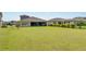 Spacious backyard with grassy area at 5608 Madrigal Way, Apollo Beach, FL 33572