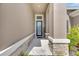 Front entry with stone walkway and a welcoming sign at 5608 Madrigal Way, Apollo Beach, FL 33572