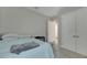 Bright bedroom with a double door closet and light blue bedding at 5608 Madrigal Way, Apollo Beach, FL 33572