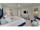 Main bedroom with a large bed and access to the bathroom and backyard at 5608 Madrigal Way, Apollo Beach, FL 33572