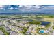 Aerial view of house, lake and community at 5608 Madrigal Way, Apollo Beach, FL 33572
