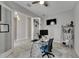 Spacious home office with hardwood floors and a large desk at 5608 Madrigal Way, Apollo Beach, FL 33572