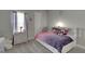 Charming bedroom with a full-size bed, dresser, and window coverings at 5608 Madrigal Way, Apollo Beach, FL 33572