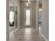 Bright and airy entryway with tile flooring and interior doors at 5608 Madrigal Way, Apollo Beach, FL 33572