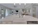 Kitchen island with farmhouse sink and seating for three at 5608 Madrigal Way, Apollo Beach, FL 33572