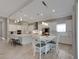 Spacious kitchen featuring white cabinets, stainless steel appliances, and an island with seating at 5608 Madrigal Way, Apollo Beach, FL 33572