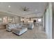 Spacious living area with comfortable sectional sofa, hardwood floors and large windows at 5608 Madrigal Way, Apollo Beach, FL 33572