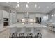 Modern kitchen with large island and stainless steel appliances at 5608 Madrigal Way, Apollo Beach, FL 33572