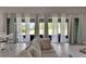 Bright living room with large sliding glass doors leading to backyard at 5608 Madrigal Way, Apollo Beach, FL 33572