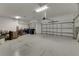 Attached garage with automatic door opener and storage at 5608 Madrigal Way, Apollo Beach, FL 33572