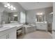 Elegant bathroom with double vanity, soaking tub, and walk-in shower at 5608 Madrigal Way, Apollo Beach, FL 33572